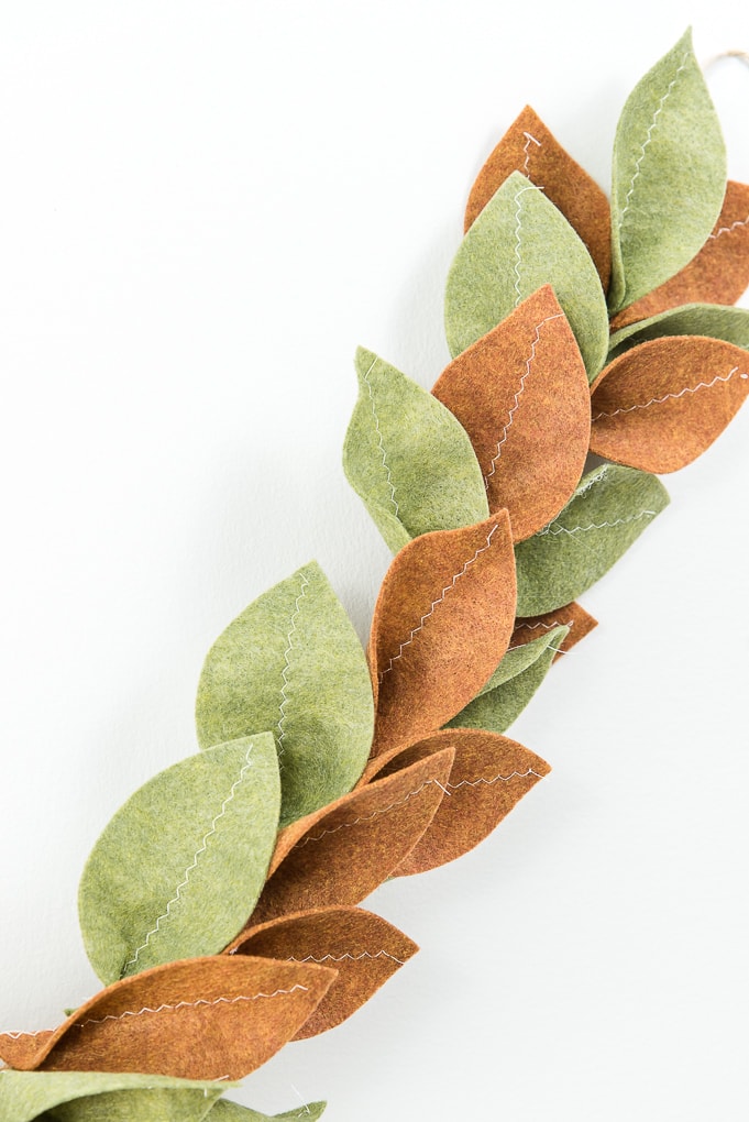 close up of finished felt magnolia garland green and tan