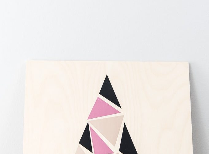 close up modern geometric tree sign pink champagne and black