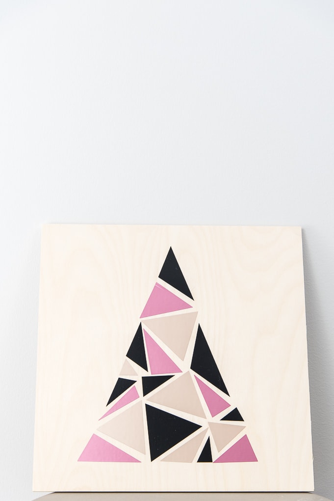 close up modern geometric tree sign pink champagne and black
