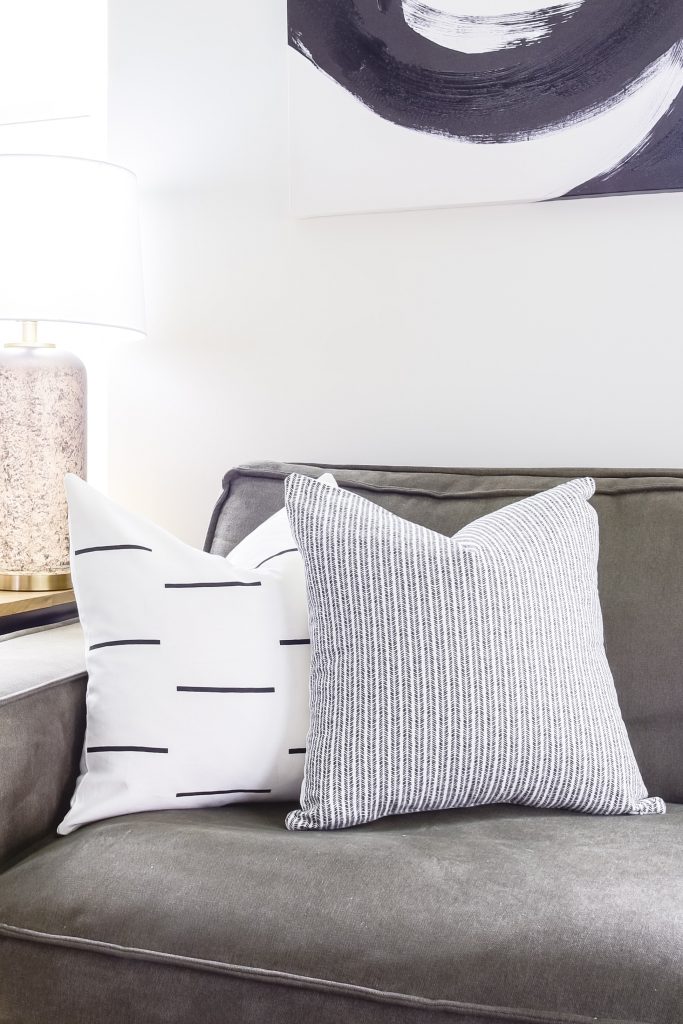 woven nook pillows on a couch left