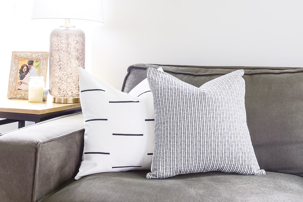 woven nook pillows on a couch left
