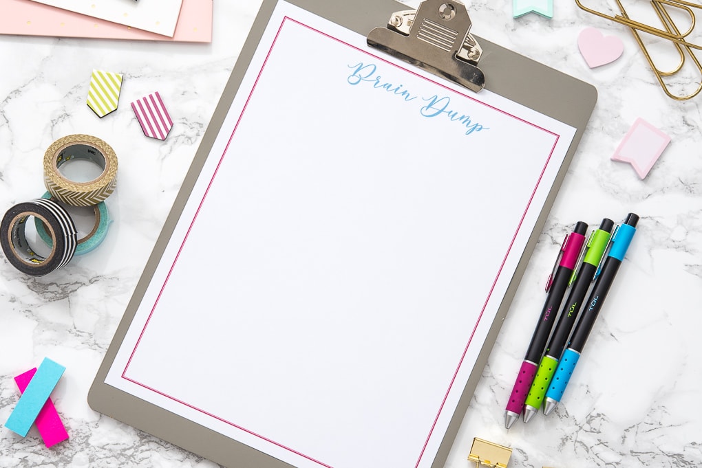 blank free printable brain dump worksheet on desk with accessories