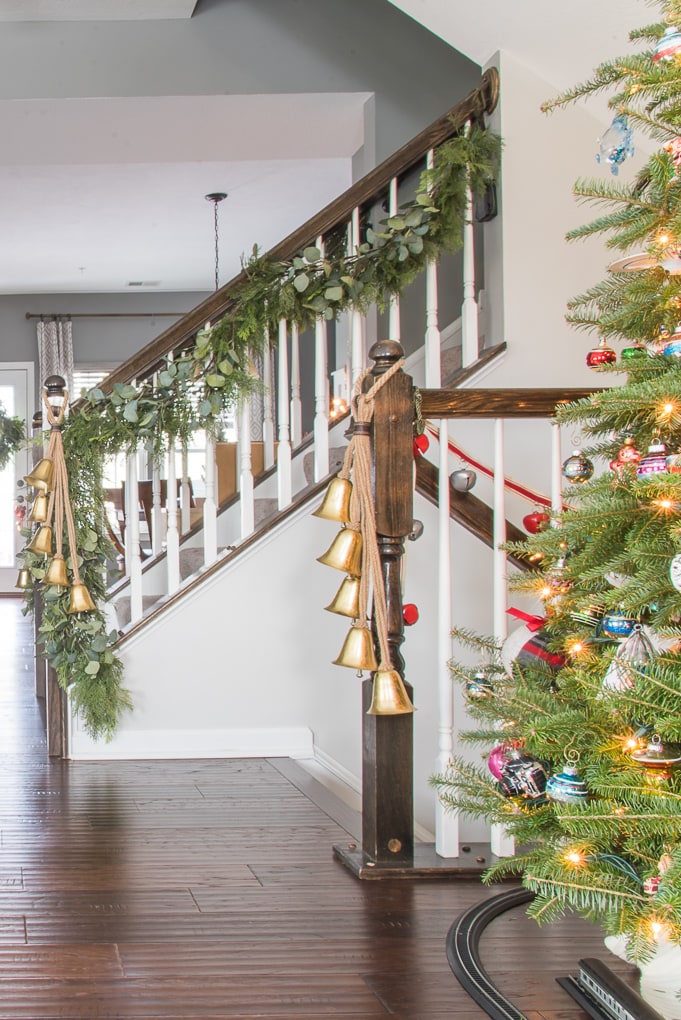 faux greenery Christmas garland on staircase