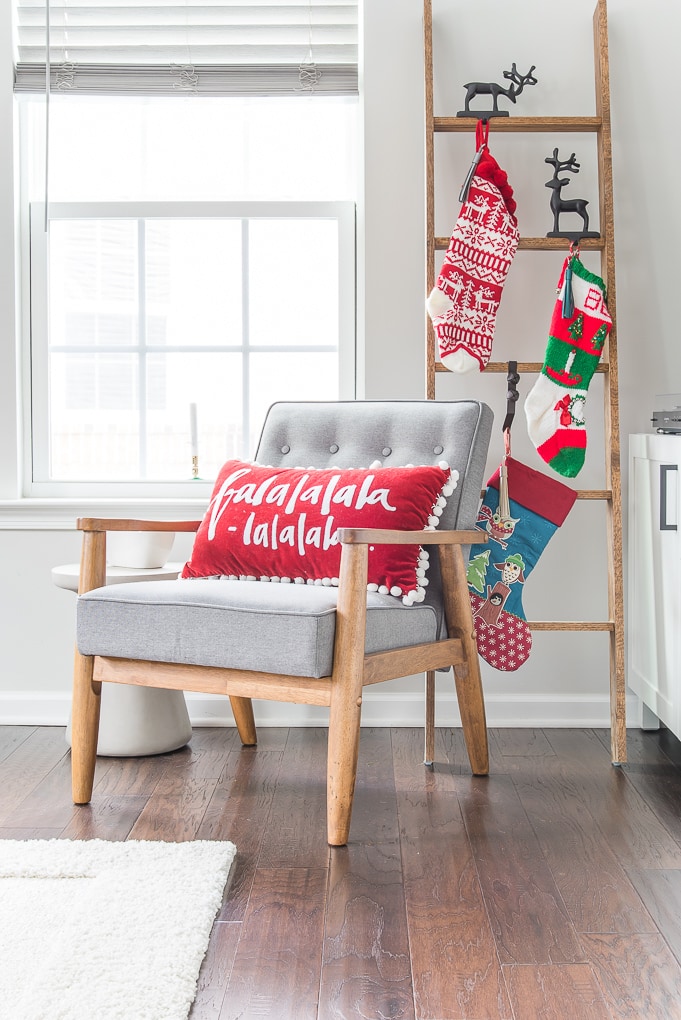 Christmas stocking ladder and accent chair decor