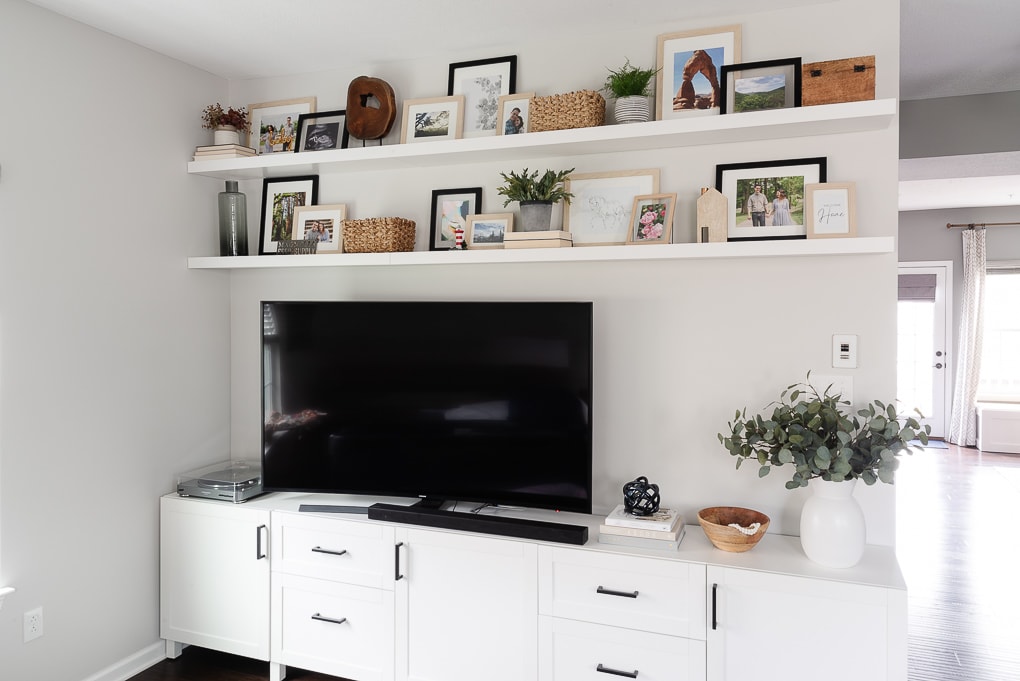 decorated IKEA LACK shelves with framed family photos