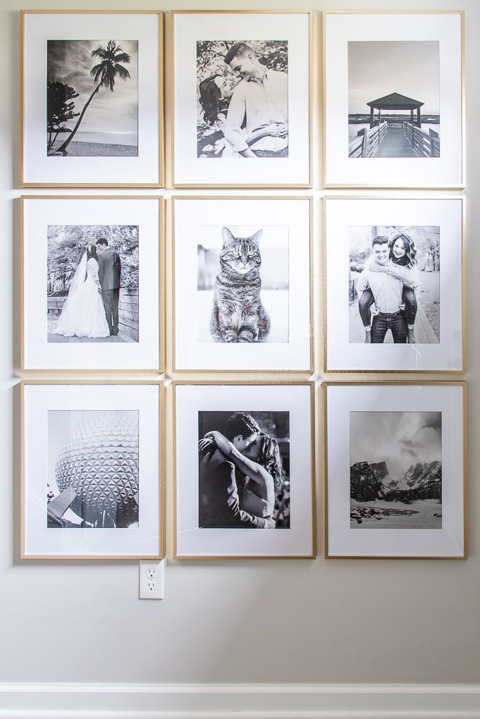 black and white gallery wall of family photos