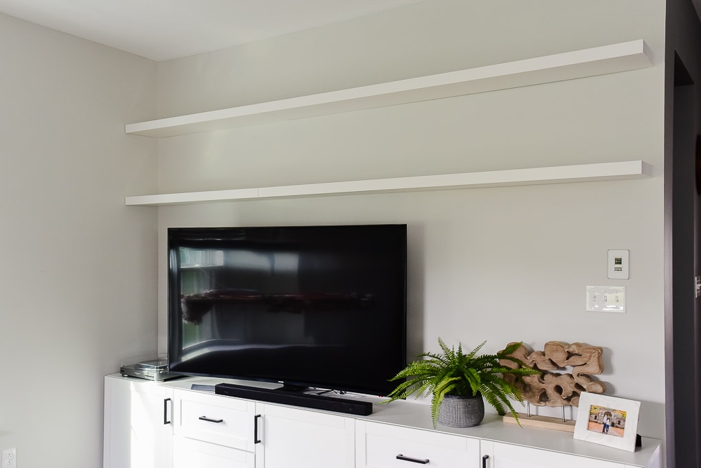 white IKEA LACK floating shelves in living room