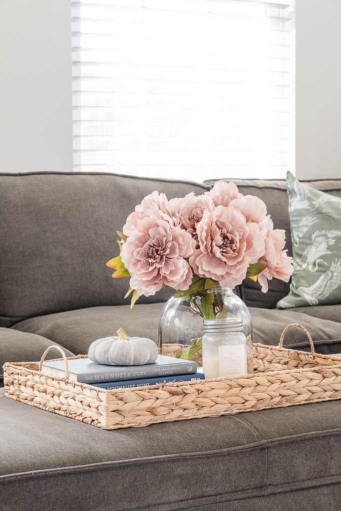 fall floral on tray in living room with fall candle