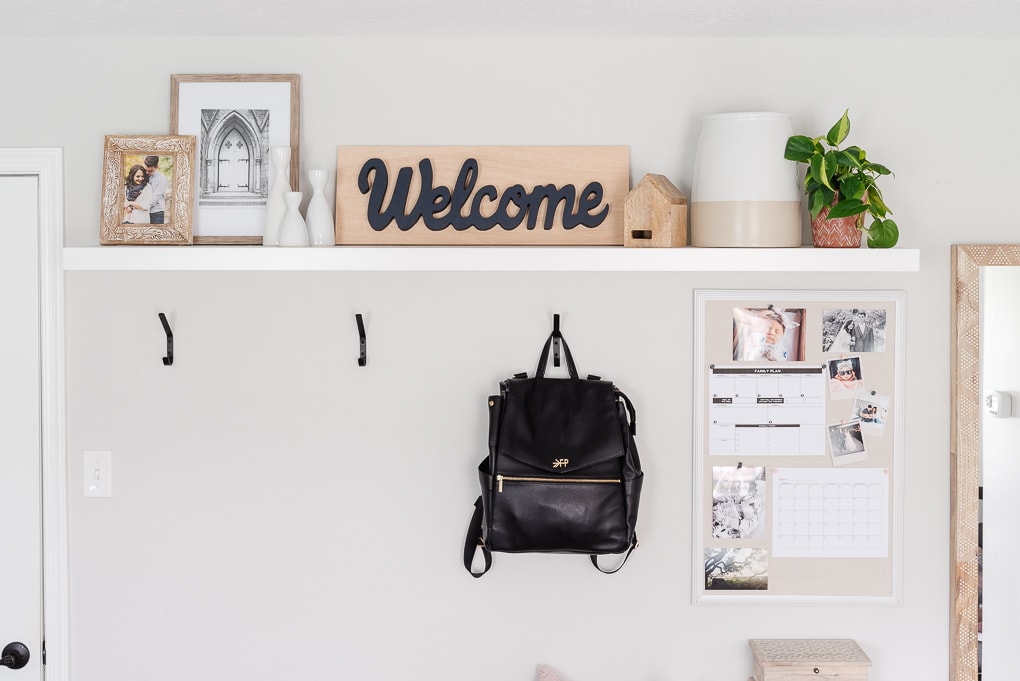 entrway decorated shelf in mudroom