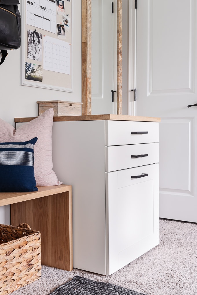 ikea sektion cabinet used in mudroom entryway for command center