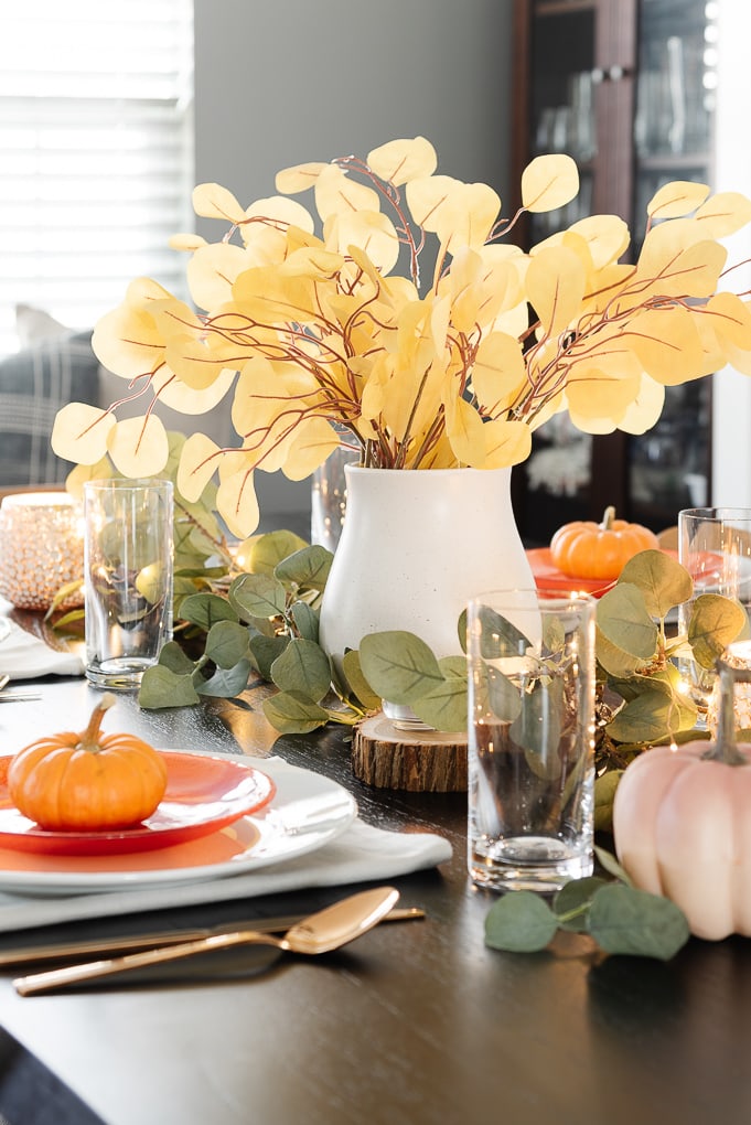 thanksgiving centerpiece white vase and yellow eucalyptus