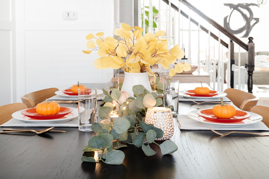 faux eucalyptus on black table thanksgiving decor