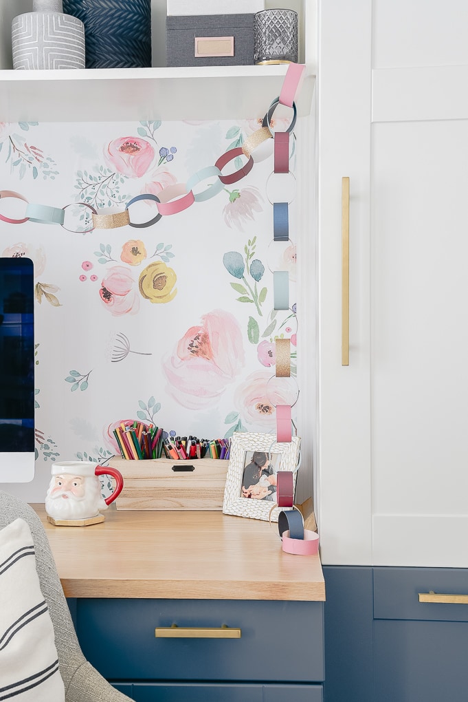 colorful Christmas paper chain against removable wallpaper wall