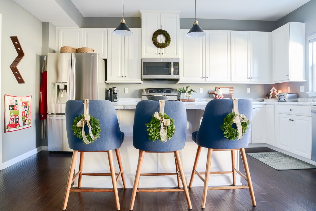 Christmas kitchen decor with mini Christmas greenery wreaths with bows