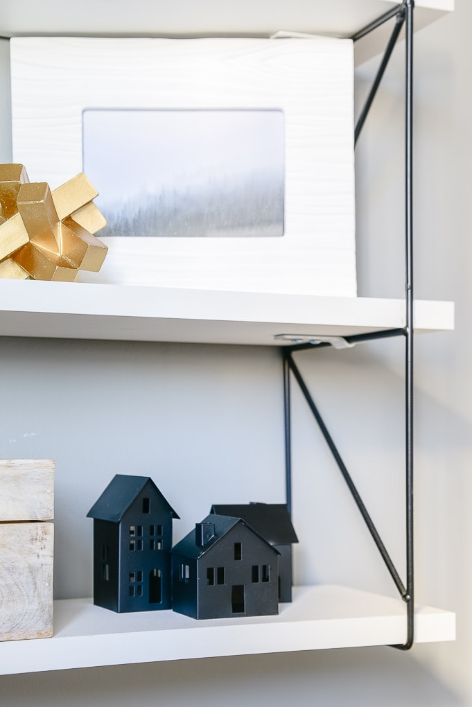 small black metal Christmas village houses from Target styled on shelves