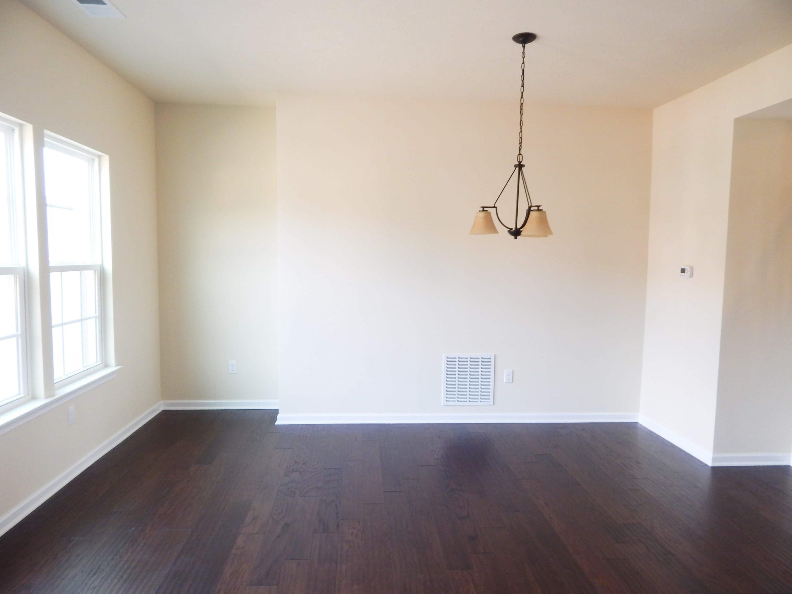 empty dining room in townhome with yellow paint on the walls