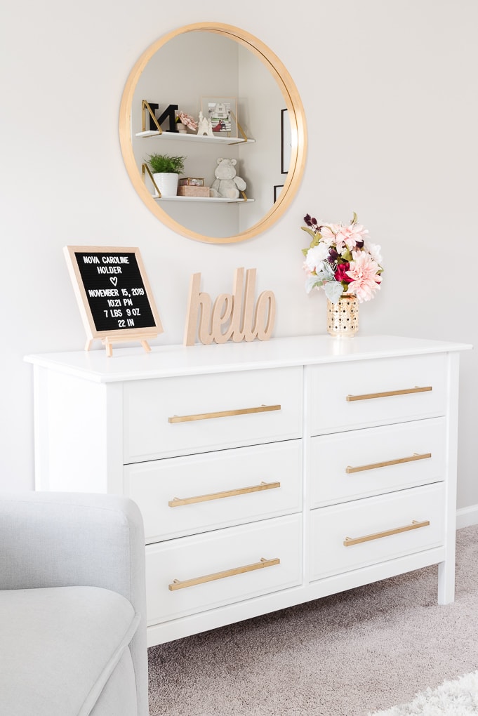 white nursery dresser with gold handles