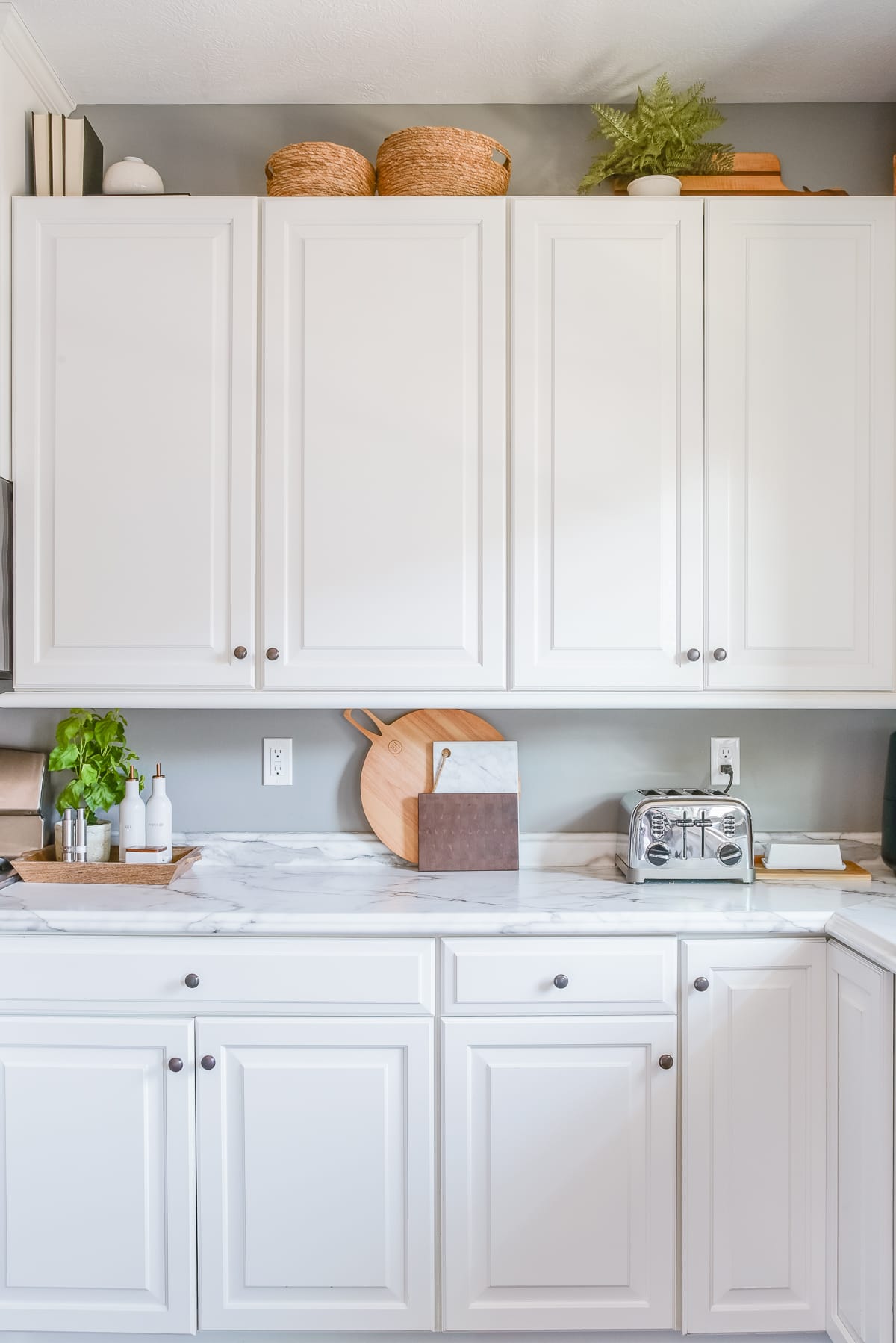 How to Decorate on Top of Your Kitchen Cabinets  